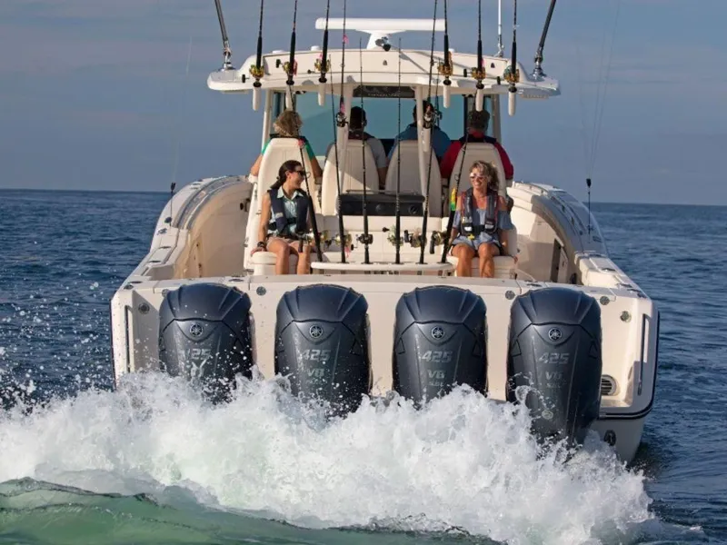 Slide: The Image of Grady-White Canyon 456 boat, 2026 model, on open sea with four engines. - 8