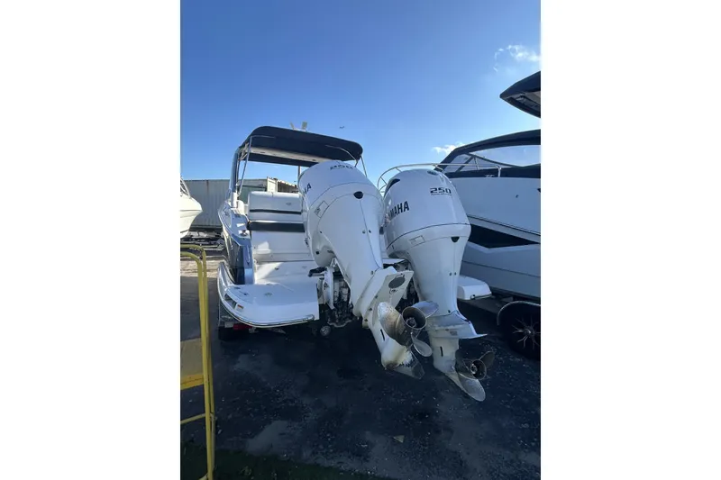 Slide: The Image of 2017 Regal 2900 Bowrider with twin Yamaha 250 outboard engines, docked outdoors. - 5