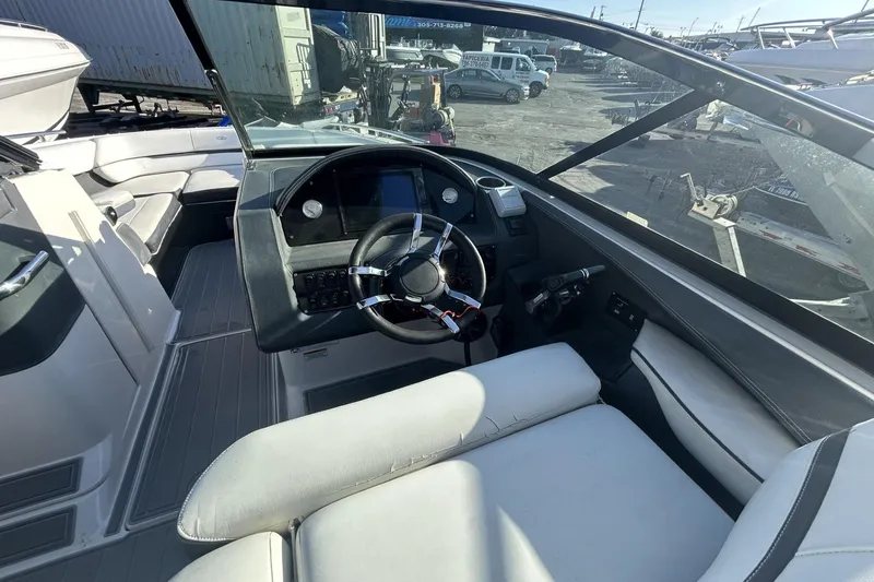 Slide: The Image of 2017 Regal 2900 Bowrider cockpit with steering wheel and seating area. - 8