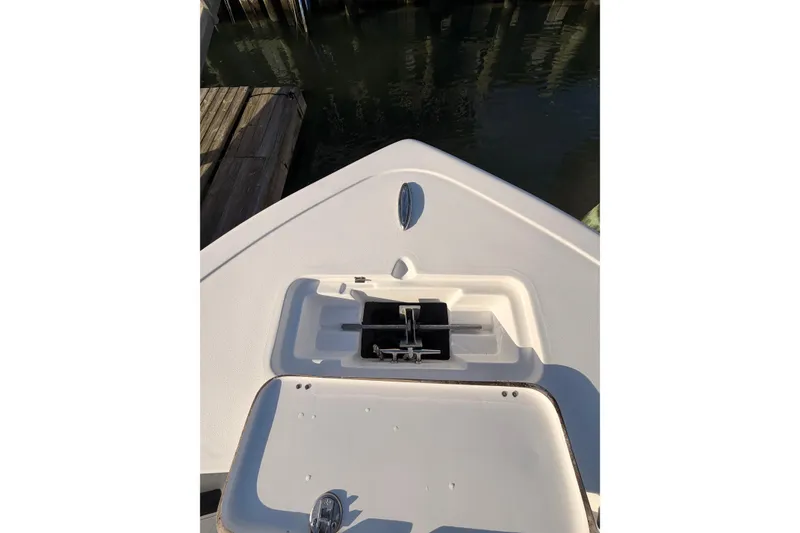 Slide: The Image of 2022 Tidewater 220 LXF boat interior with compact marine toilet. - 11