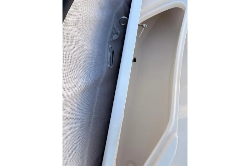 Slide: The Image of Interior view of a 2022 Tidewater 220 LXF boat, showcasing seating and fixtures. - 13