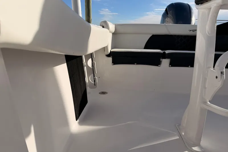 Slide: The Image of 2022 Tidewater 220 LXF boat interior with white seating and sleek design. - 15
