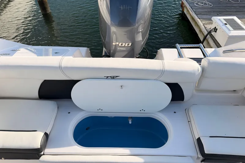Slide: The Image of 2022 Tidewater 220 LXF boat storage compartment, open and empty. - 17