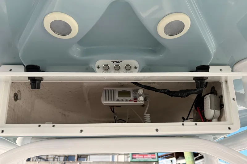 Slide: The Image of 2022 Tidewater 220 LXF boat console with electronics and storage compartment. - 9