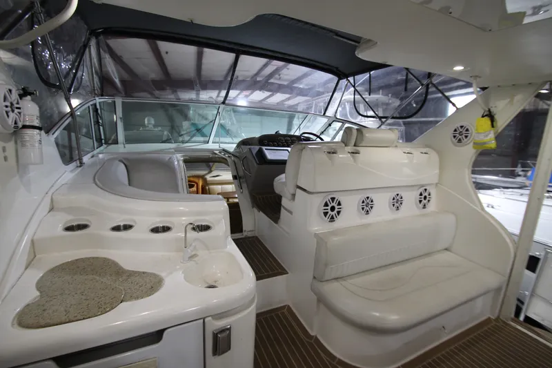 Slide: The Image of 2003 Cruisers Yachts 4450 Express Motoryacht interior with seating and helm station. - 14