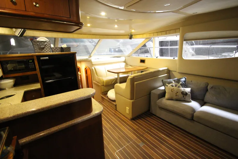 Slide: The Image of Luxurious interior of 2003 Cruisers Yachts 4450 Express Motoryacht with cozy seating and modern amenities. - 25