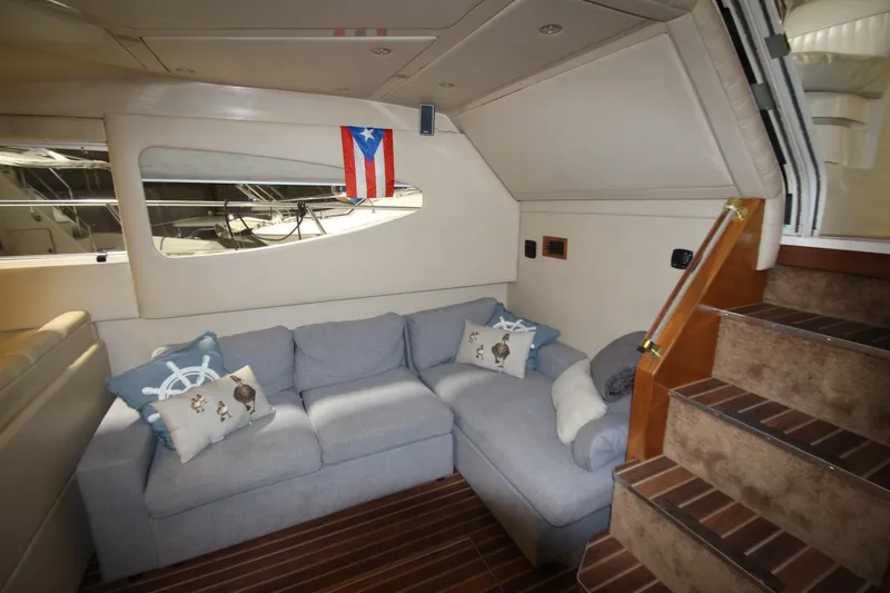 Slide: The Image of Interior of 2003 Cruisers Yachts 4450 Express Motoryacht with cozy seating and nautical decor. - 27