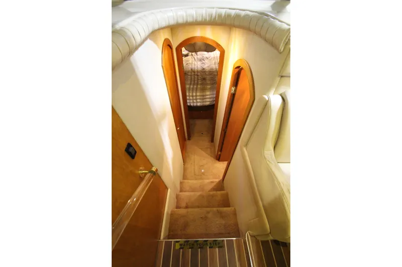 Slide: The Image of Interior stairs of 2003 Cruisers Yachts 4450 Express Motoryacht, leading to cabin. - 36