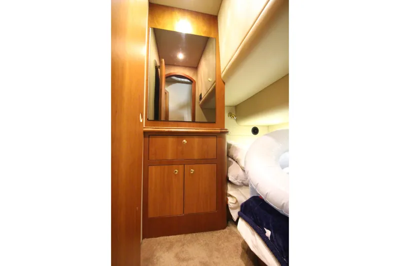 Slide: The Image of Luxurious cabin interior of 2003 Cruisers Yachts 4450 Express Motoryacht with wood cabinetry. - 37