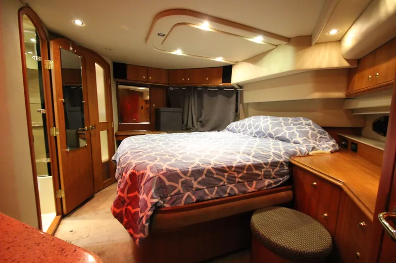 Slide: The Image of Luxurious bedroom interior of 2003 Cruisers Yachts 4450 Express Motoryacht with wood accents. - 53
