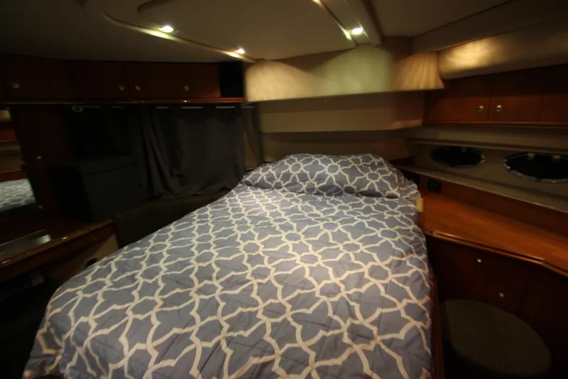 Slide: The Image of Luxurious bedroom interior of 2003 Cruisers Yachts 4450 Express Motoryacht with cozy bedding. - 56