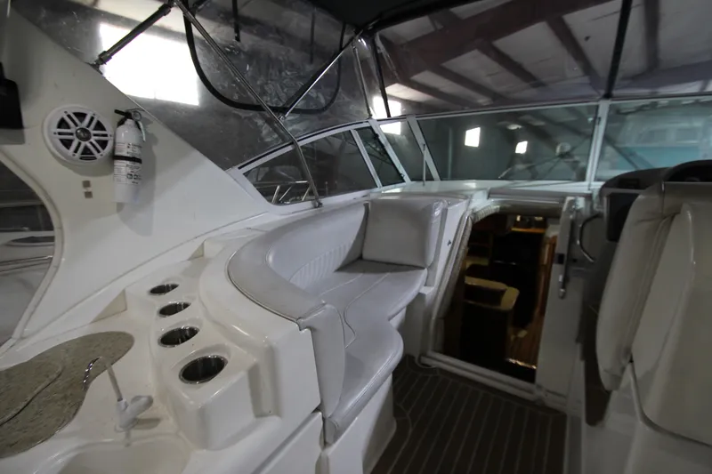 Slide: The Image of 2003 Cruisers Yachts 4450 Express Motoryacht interior with seating and helm. - 6