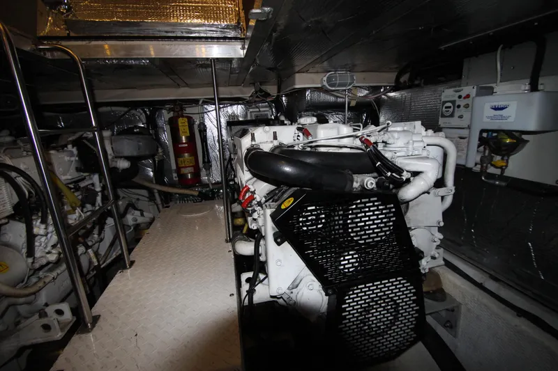 Slide: The Image of Engine room of 2003 Cruisers Yachts 4450 Express Motoryacht, featuring mechanical components. - 71
