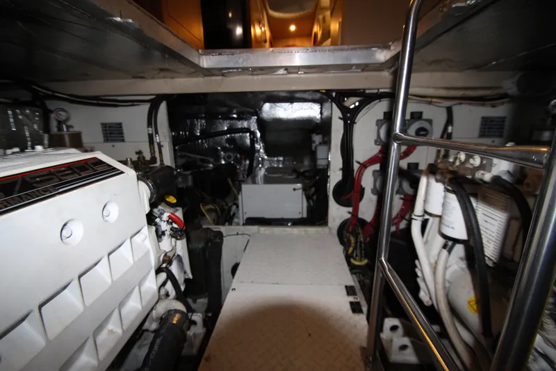 Slide: The Image of Engine room of 2003 Cruisers Yachts 4450 Express Motoryacht, showcasing mechanical components. - 73