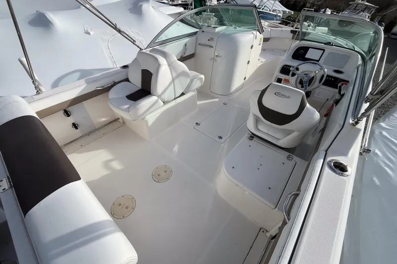 Slide: The Image of 2021 Robalo R227 Dual Console boat with powerful outboard motor, displayed outdoors. - 11