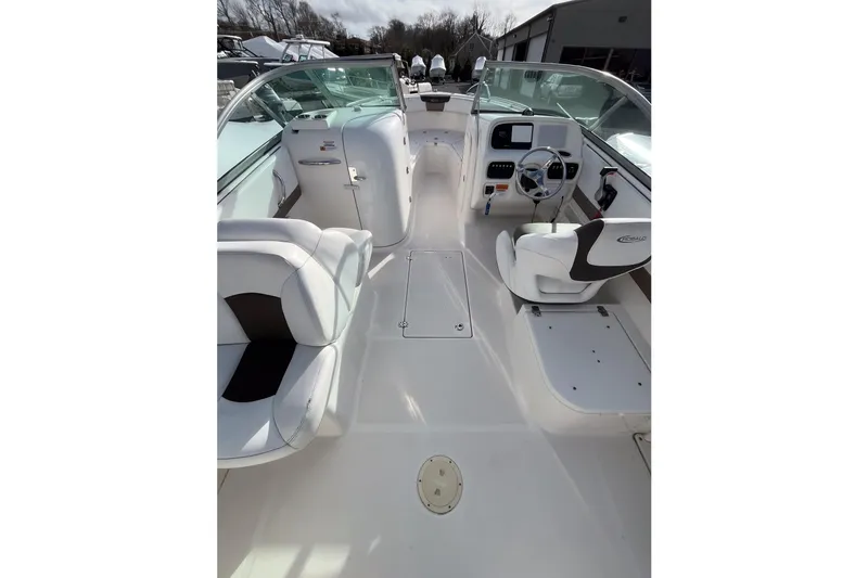 Slide: The Image of 2021 Robalo R227 Dual Console boat interior with seating and steering console. - 12