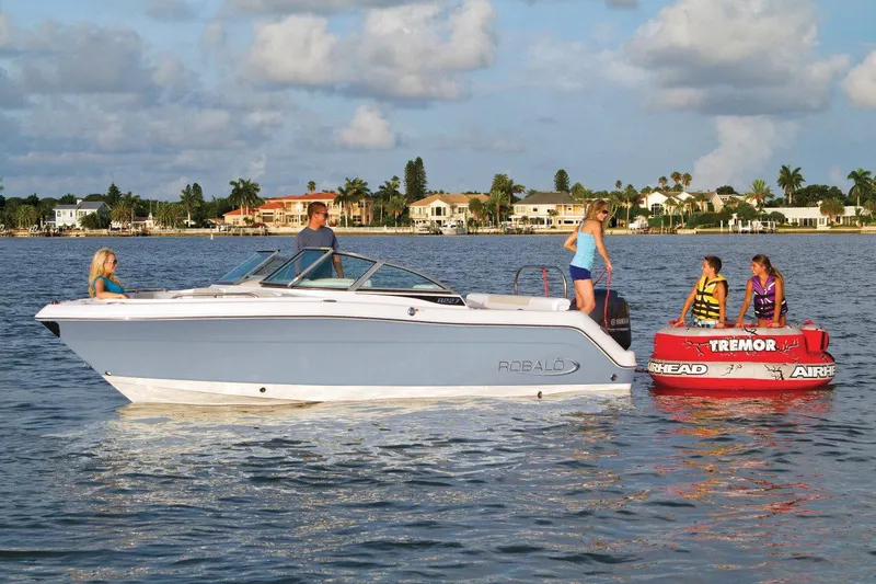 Slide: The Image of 2021 Robalo R227 Dual Console boat interior with seating and steering console. - 3