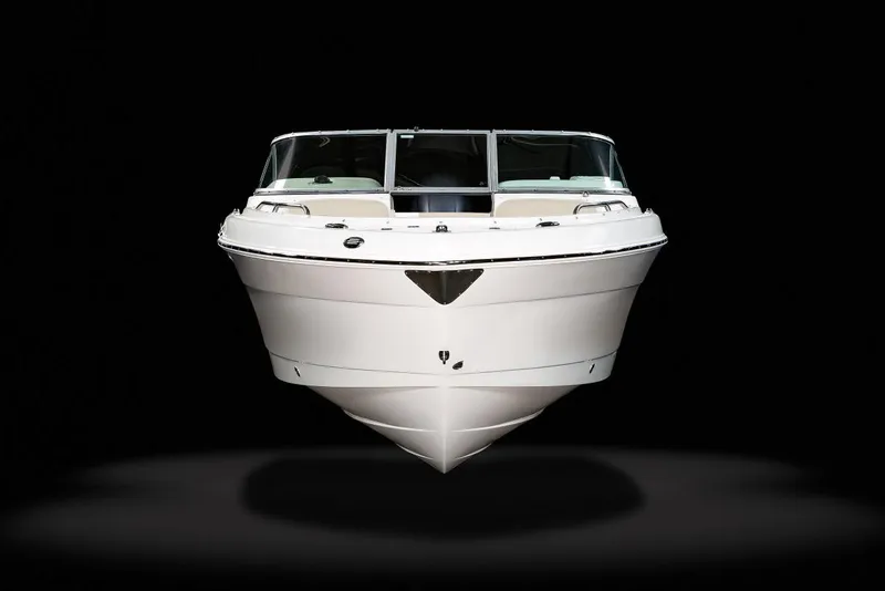 Slide: The Image of 2021 Robalo R227 Dual Console boat interior with white seating and spacious deck. - 4