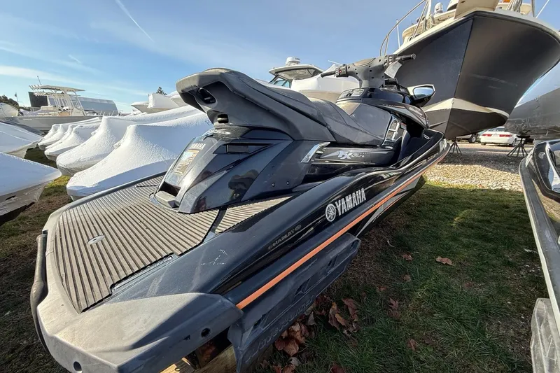 Slide: The Image of 2016 Yamaha WaveRunner FX HO jet ski parked outdoors. - 2