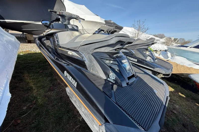 Slide: The Image of 2016 Yamaha WaveRunner FX HO jet ski parked outdoors on grass. - 3