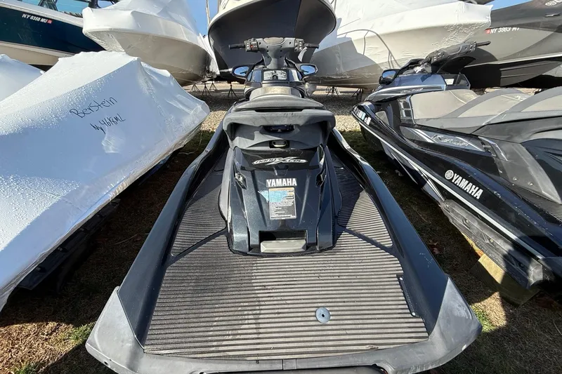 Slide: The Image of 2016 Yamaha WaveRunner FX HO jet ski parked among boats. - 5