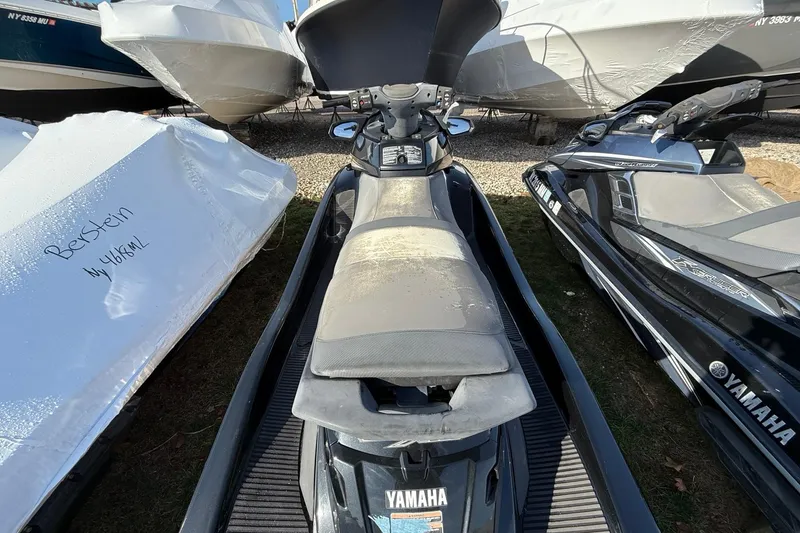 Slide: The Image of 2016 Yamaha WaveRunner FX HO jet ski parked among boats. - 6