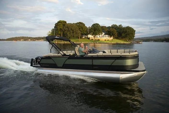 Slide: The Image of 2026 Veranda RELAX VR235VLI pontoon boat cruising on a scenic lake. - 7