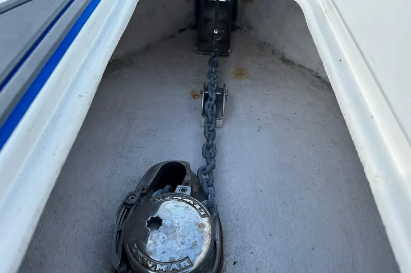 Slide: The Image of Anchor chain compartment of 2012 Renegade 32 CC boat, featuring a Lewmar windlass. - 30