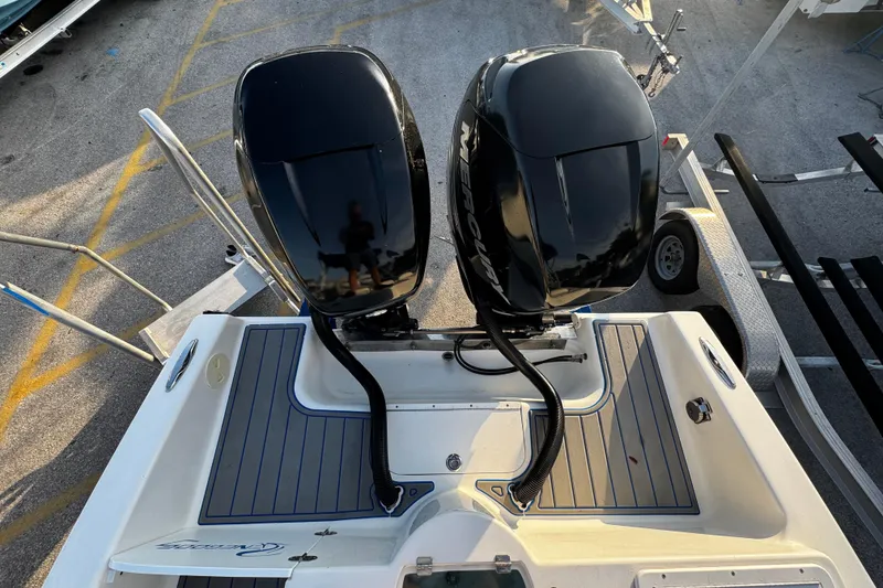 Slide: The Image of 2012 Renegade 32 CC boat with dual Mercury outboard engines, viewed from above. - 5