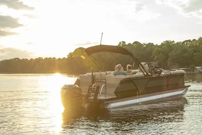 Slide: The Image of 2026 Veranda RELAX VR235VLI pontoon boat on serene lake at sunset. - 8