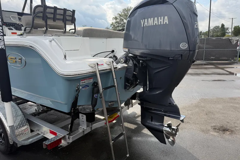 Slide: The Image of 2025 Sea Hunt Ultra 219 with Yamaha outboard motor, showcasing sleek design and power. - 10