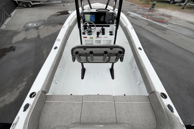 Slide: The Image of 2025 Sea Hunt Ultra 219 boat interior with seating and engine compartment. - 12