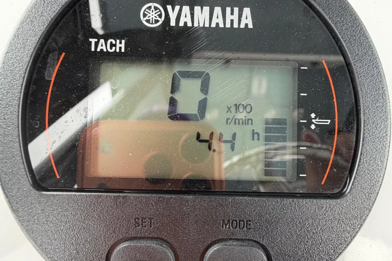 Slide: The Image of 2025 Sea Hunt Ultra 219 dashboard with JL Audio system and control switches. - 19