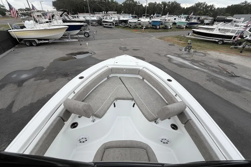 Slide: The Image of Control panel of a 2025 Sea Hunt Ultra 219 boat with trim tab controls. - 22