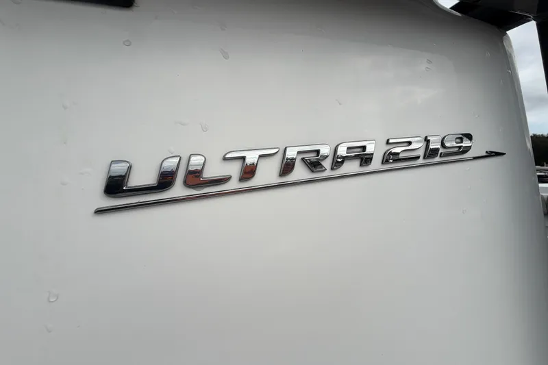 Slide: The Image of Control panel of 2025 Sea Hunt Ultra 219 boat with accessory switches and audio port. - 24