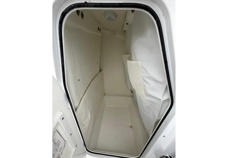 Slide: The Image of Control panel of 2025 Sea Hunt Ultra 219 boat with Yamaha throttle and Garmin display. - 25