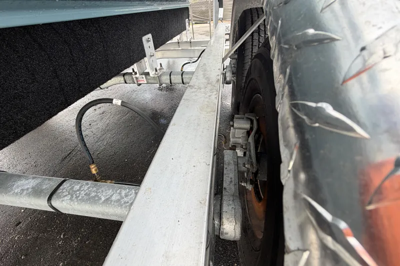 Slide: The Image of 2025 Sea Hunt Ultra 219 boat interior with cushioned seating and cup holders. - 36