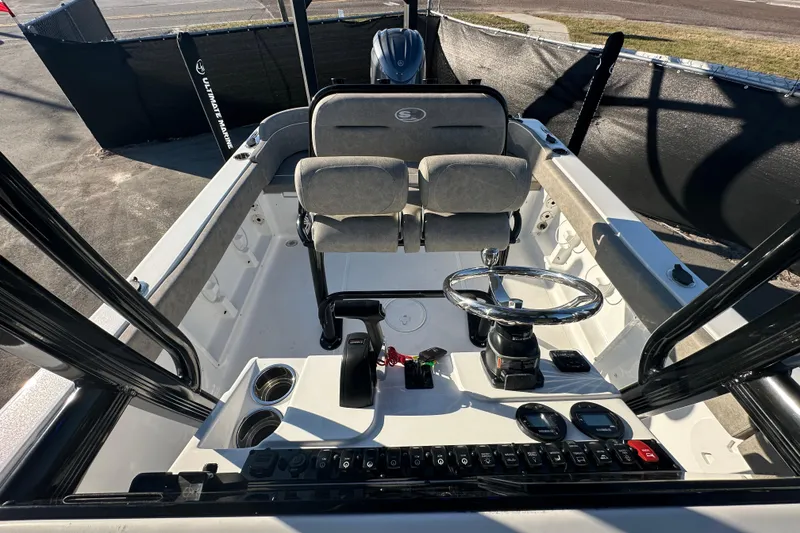 Slide: The Image of 2025 Sea Hunt Ultra 219 boat interior with steering wheel and controls. - 53