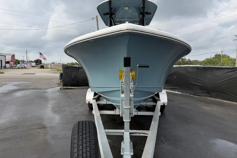 Slide: The Image of Rear view of 2025 Sea Hunt Ultra 219 boat with ladder and motor. - 7