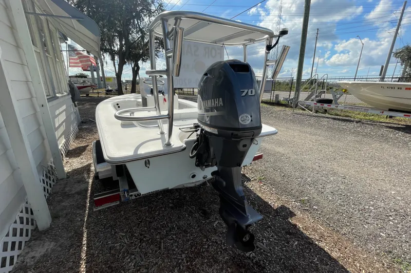 Slide: The Image of 2026 Delta Boatworks Delta D18 with Yamaha 70 outboard motor, parked outdoors. - 3