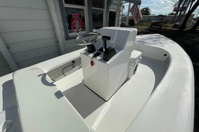Slide: The Image of 2026 Delta Boatworks Delta D18 with sleek white console and steering wheel. - 4