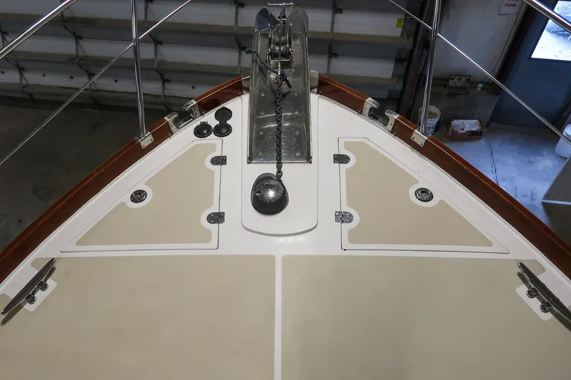 Slide: The Image of Bow view of 2007 Grand Banks 39 Eastbay SX yacht in a garage setting. - 14