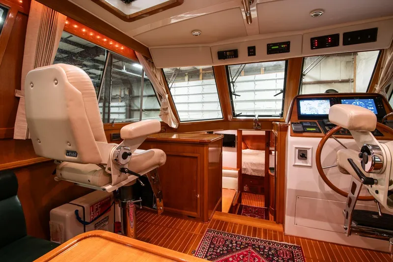 Slide: The Image of 2007 Grand Banks 39 Eastbay SX yacht interior with helm station and luxurious seating. - 18