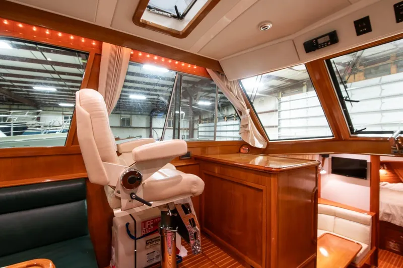 Slide: The Image of Interior of 2007 Grand Banks 39 Eastbay SX yacht with helm station and luxurious seating. - 23