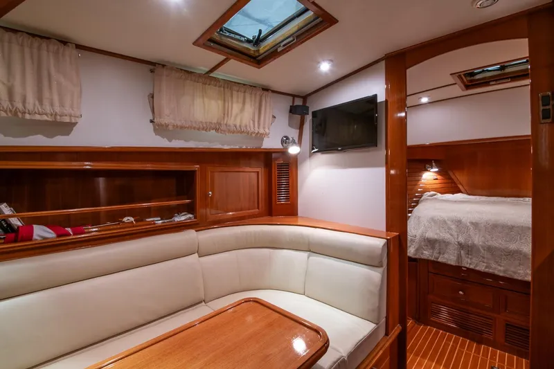 Slide: The Image of Luxurious 2007 Grand Banks 39 Eastbay SX yacht interior with cozy seating and elegant wood finish. - 29
