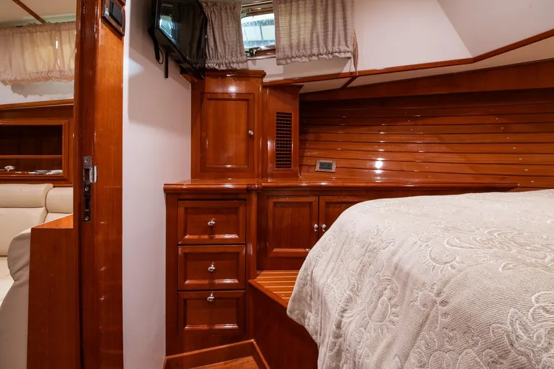 Slide: The Image of Luxurious 2007 Grand Banks 39 Eastbay SX cabin with elegant wood finish and cozy bedding. - 32