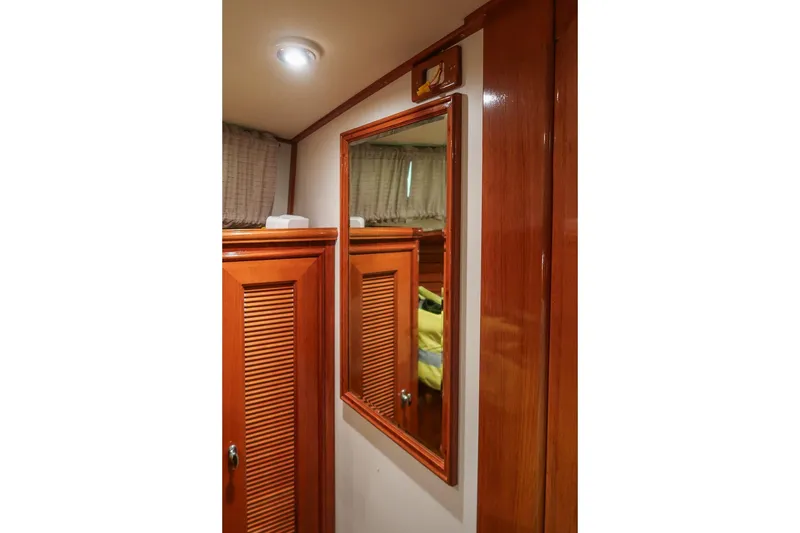 Slide: The Image of Interior of 2007 Grand Banks 39 Eastbay SX with wooden cabinetry and mirror. - 34