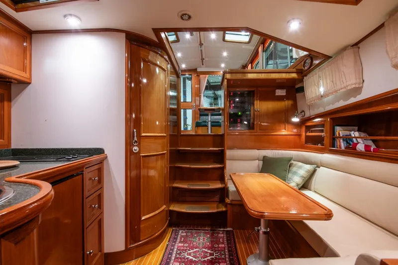 Slide: The Image of Luxurious 2007 Grand Banks 39 Eastbay SX yacht interior with wood finish and cozy seating area. - 39