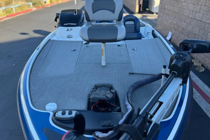 Slide: The Image of 2015 Nitro Z-7 fishing boat with trolling motor and seating on deck. - 12