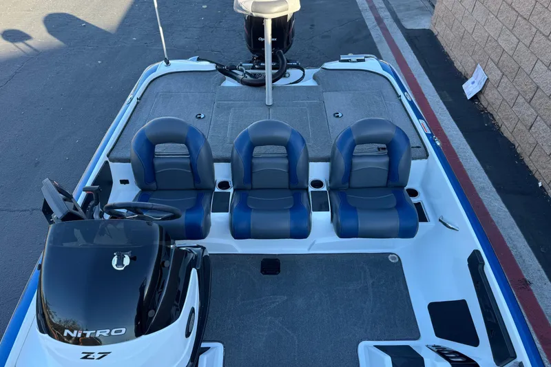 Slide: The Image of 2015 Nitro Z-7 boat interior with blue seats and steering console. - 16